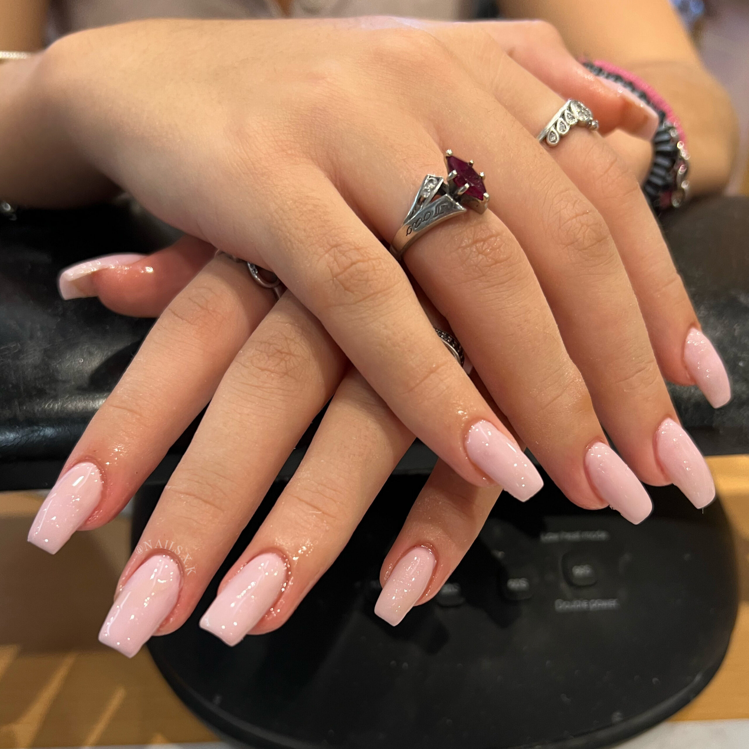 Medium hard gel set with a light pink color. Nails by K