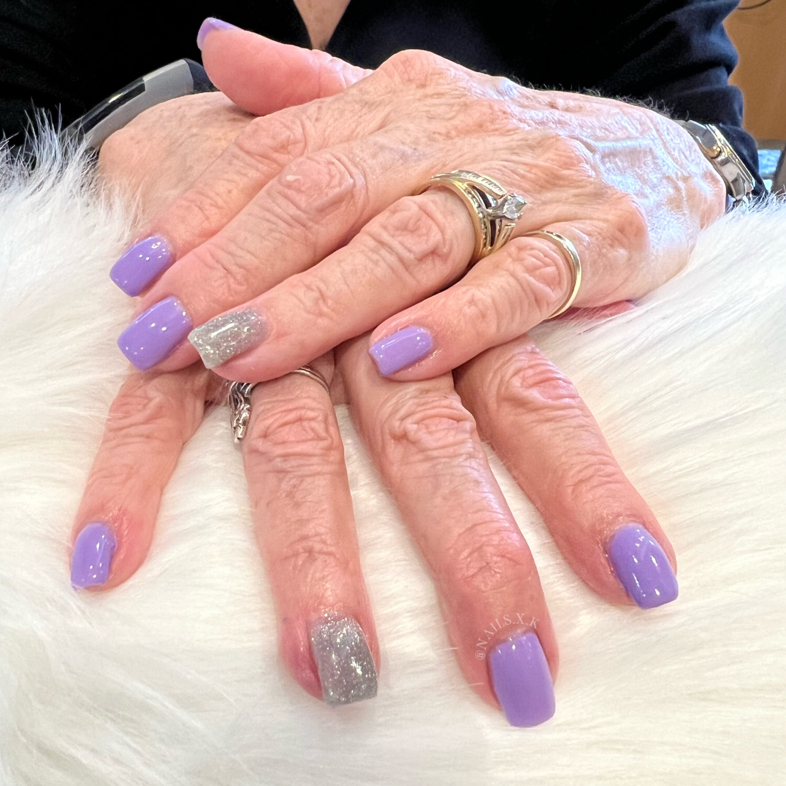 Lavender gel manicure with silver glitter accent nails. Nails by K