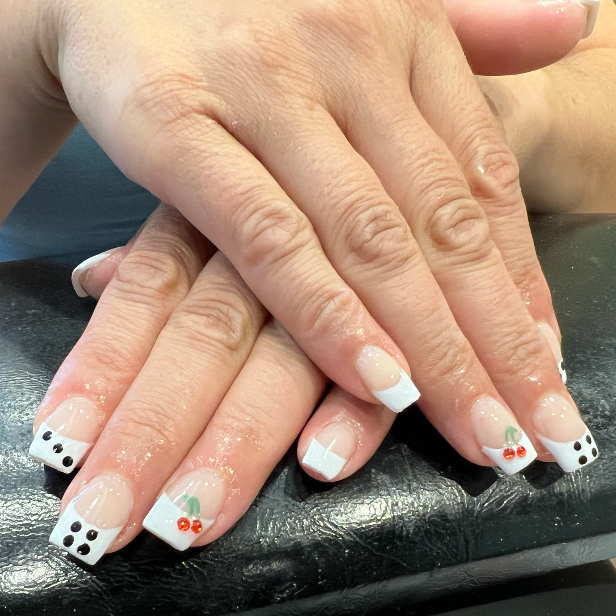 Short acrylic set with french tips with a Las Vegas vibe. Nails by K