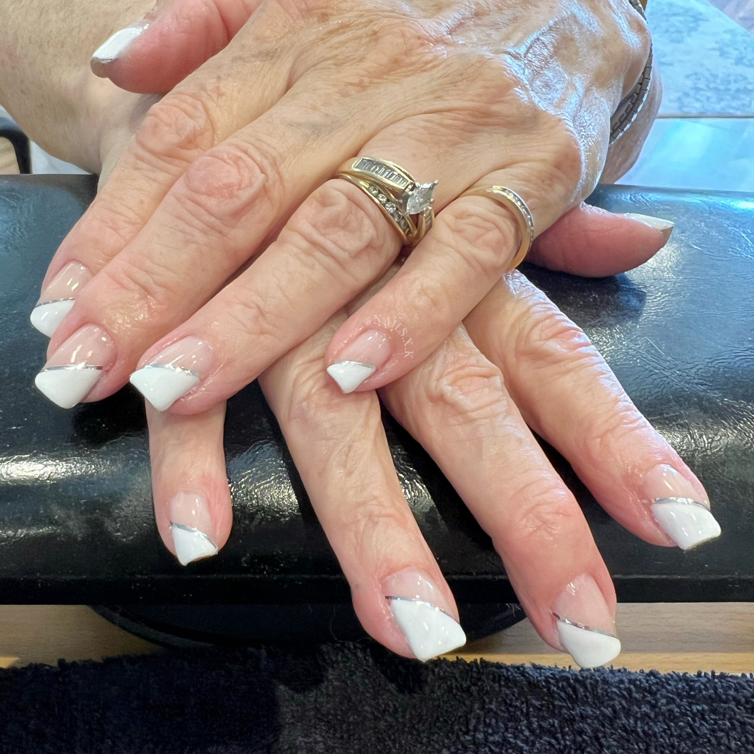 Diagonal french gel manicure with silver accents. Nails by K