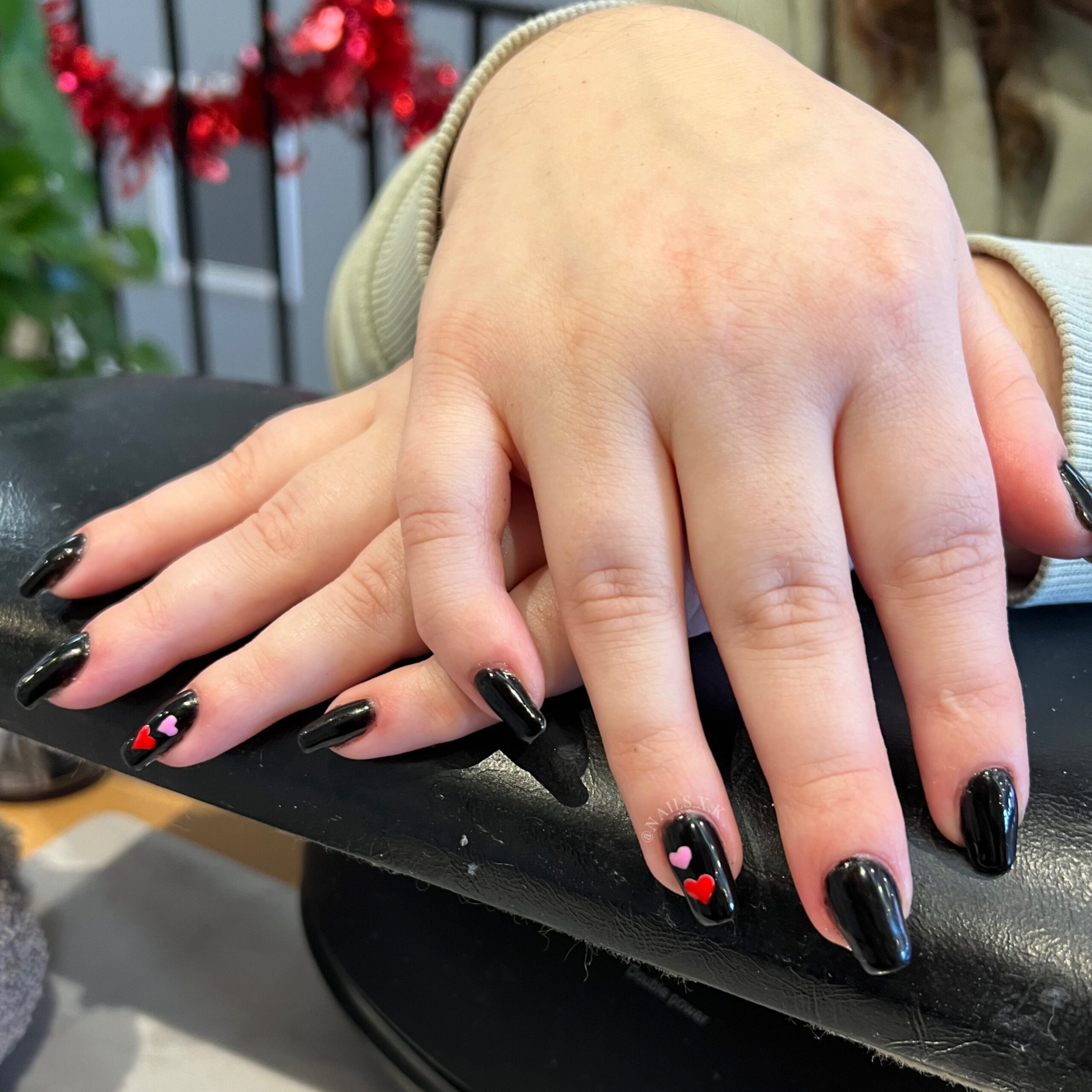 Gel manicure with black and hand painted heart accent nails. Nails by K