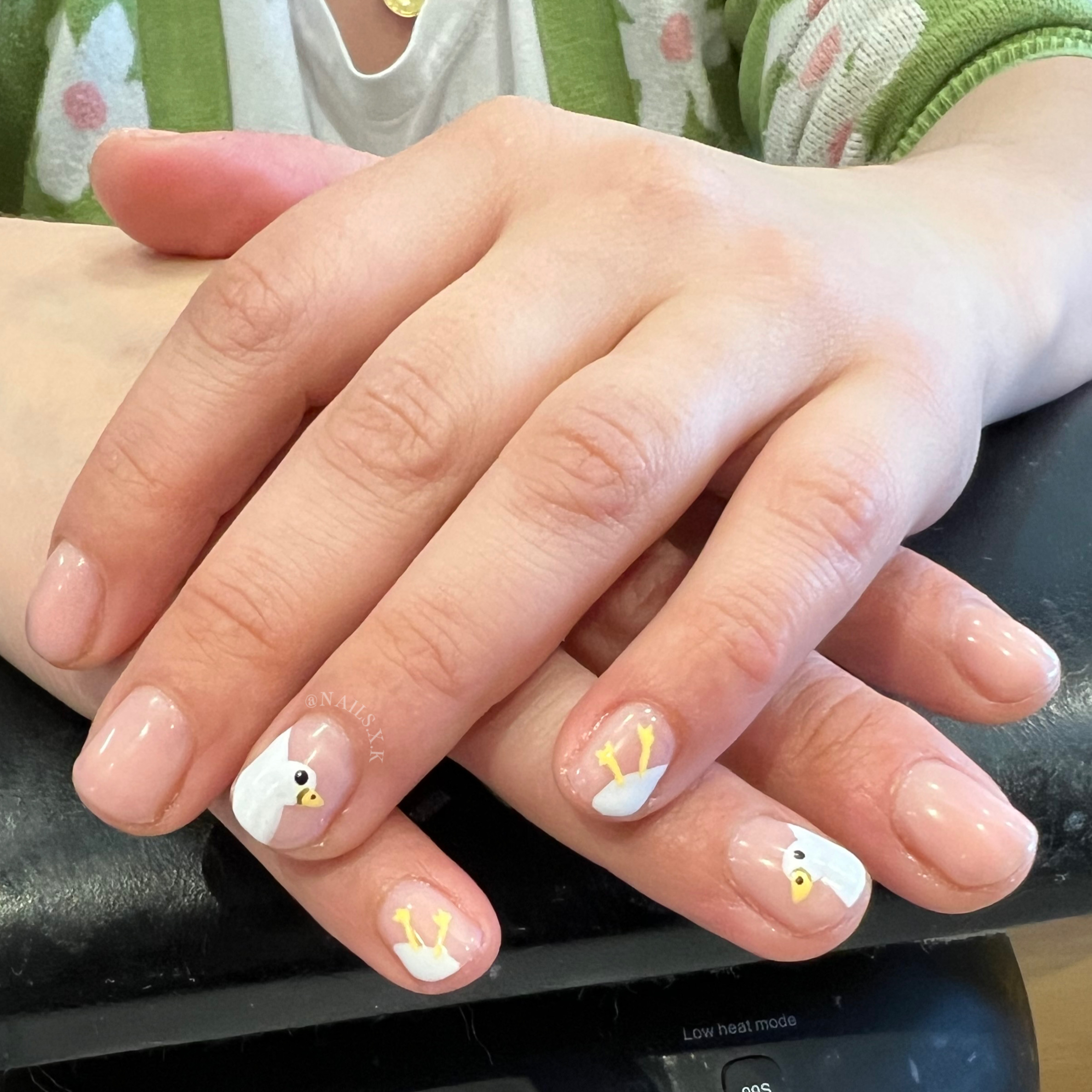 Gel manicure with nude background and hand painted ducks. Nails by K