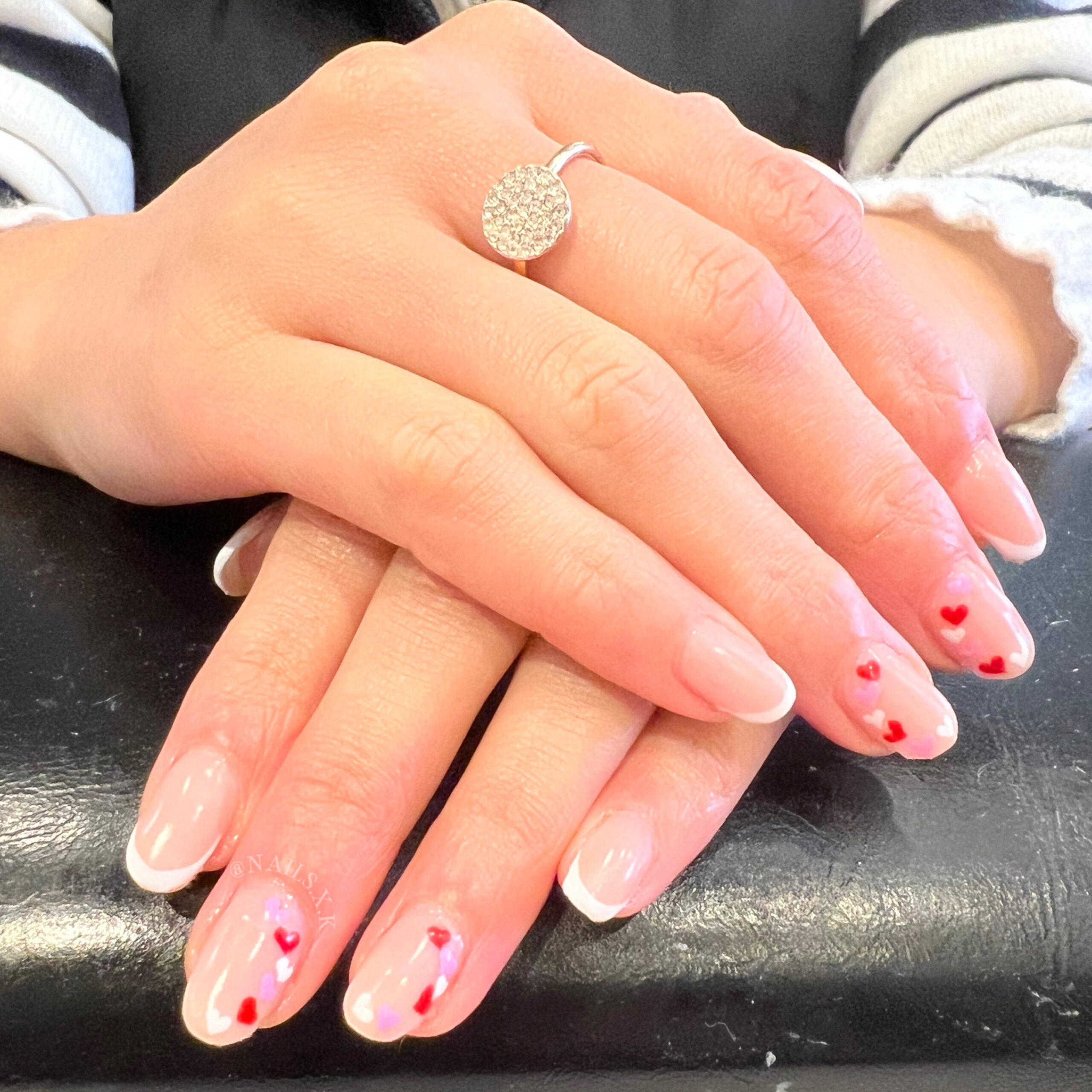 Hard gel nails with hand painted french tips and heart accent designs. Nails by K