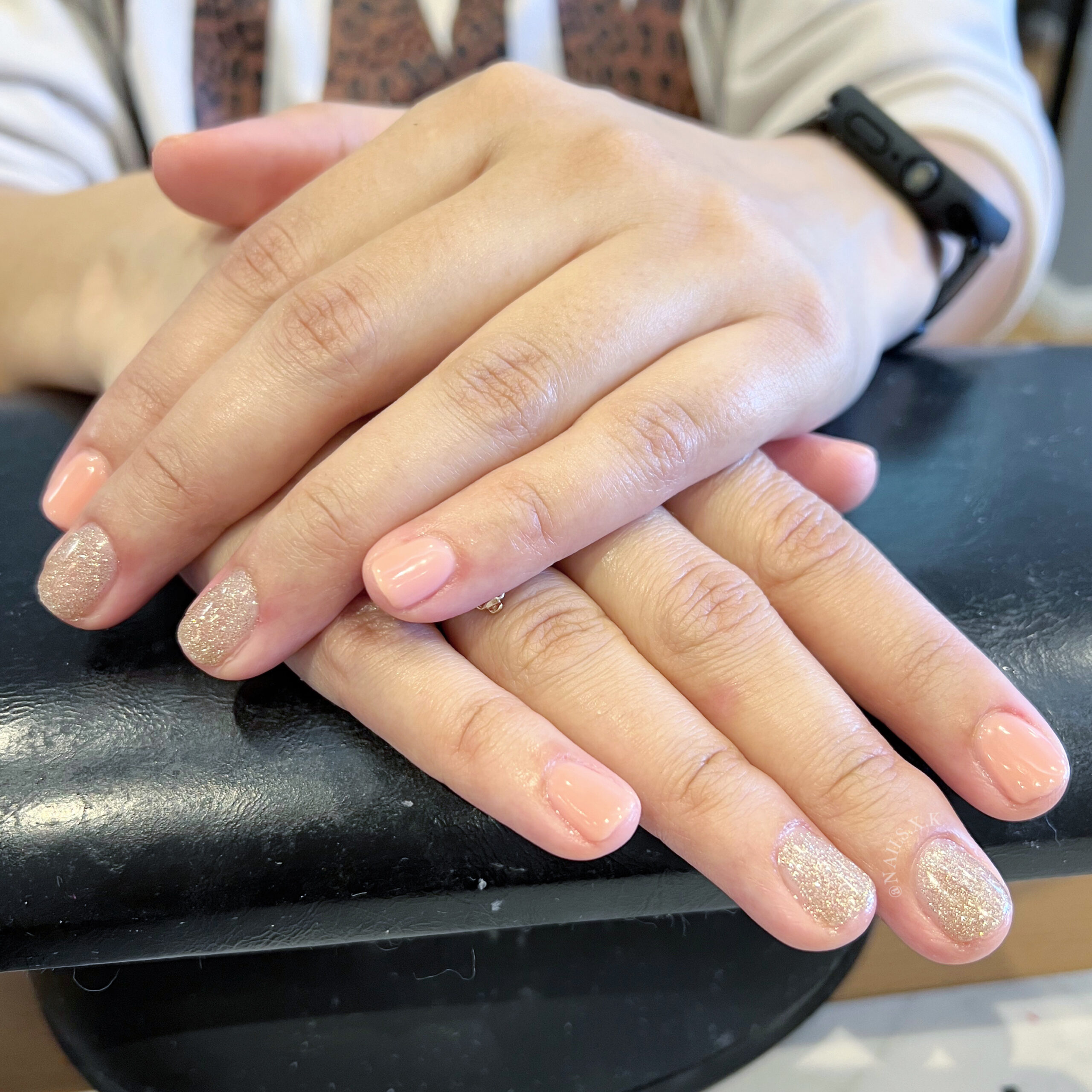 Gel manicure with nude pink and gold glitter accents. Nails by K