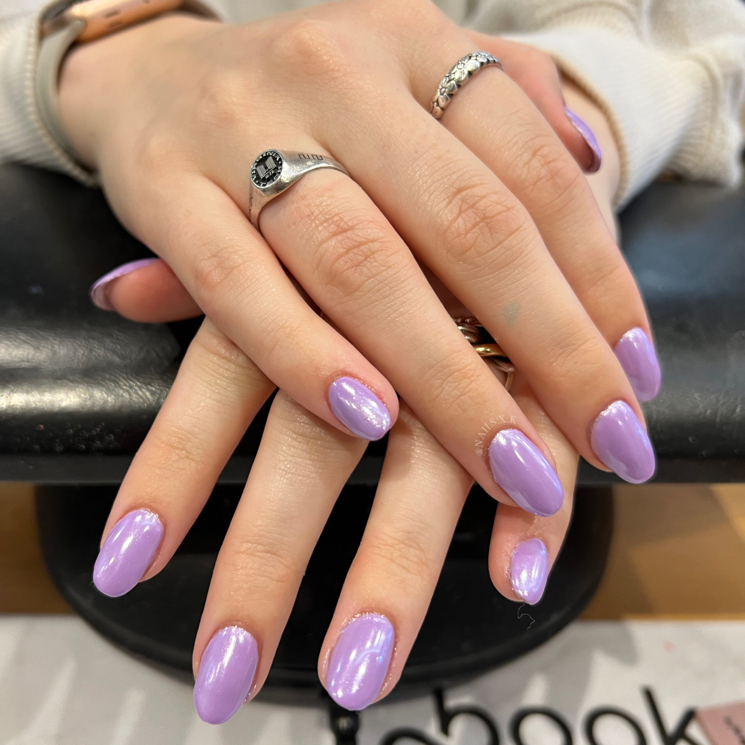 Acrylic fill with a lavender color and pearl chrome on top. Nails by K