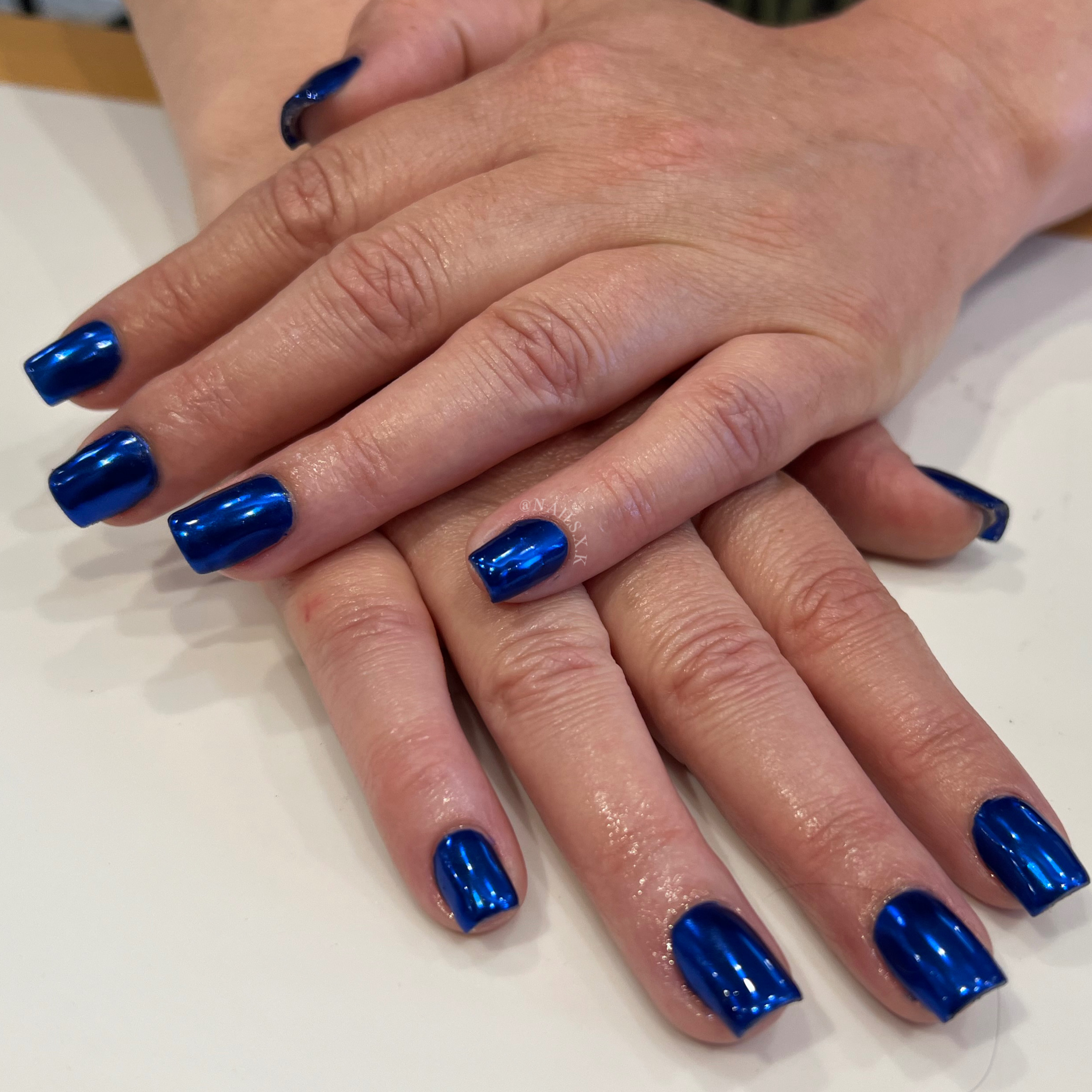 Acrylic fill with blue chrome. Nails by K