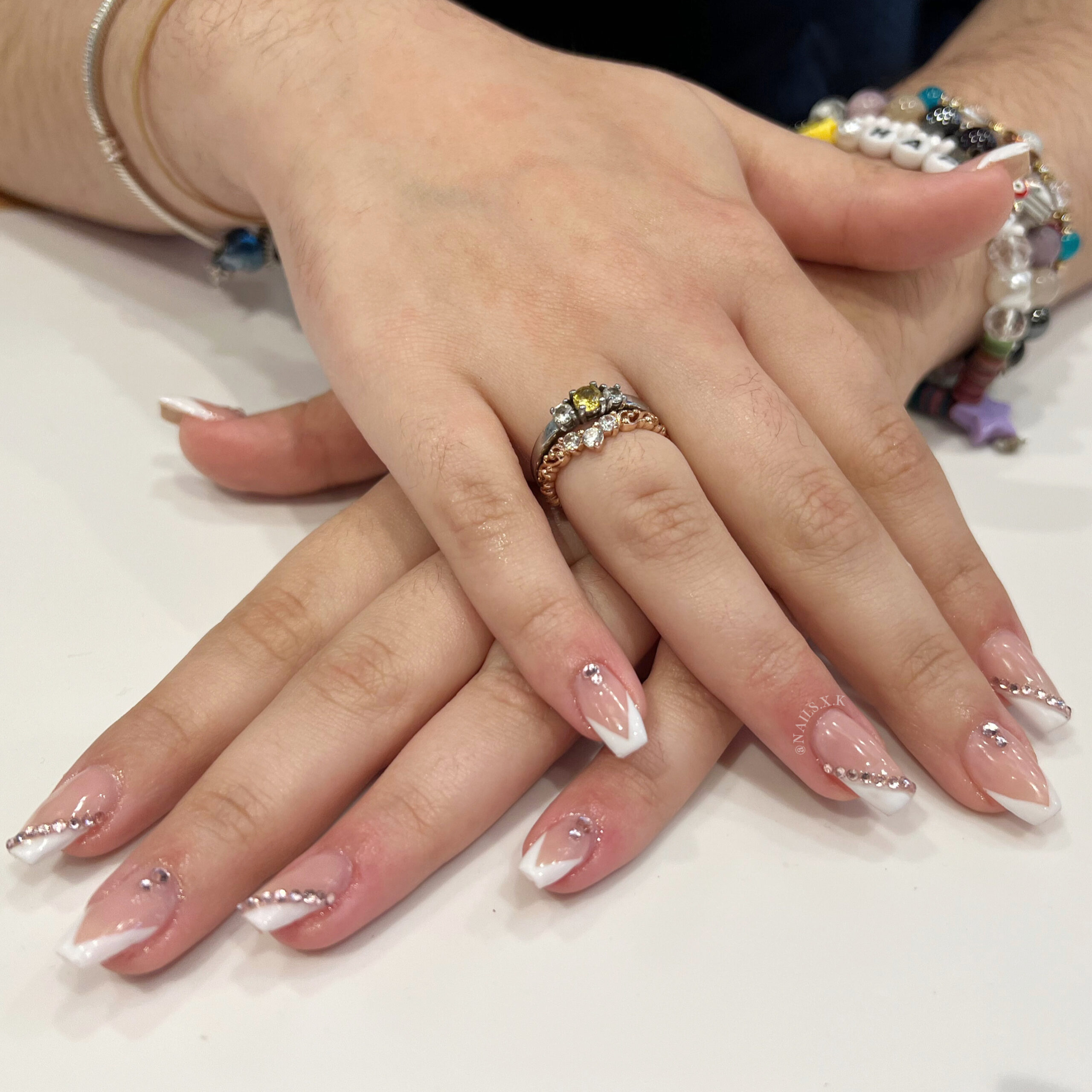 Hard Gel with V-french tips and rhinestone accents. Nails by K