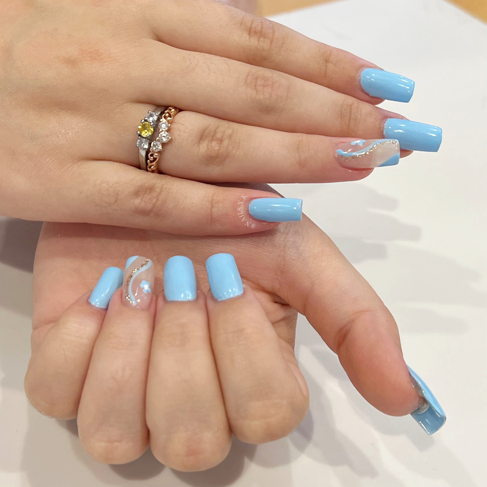 Hard Gel Full Set with a Light Blue Color and Hand Painted Accent Nails Nails by K