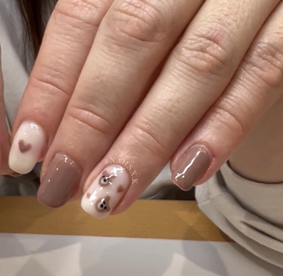 Gel manicure with hand painted teddy bear faces and hearts. Nails by K