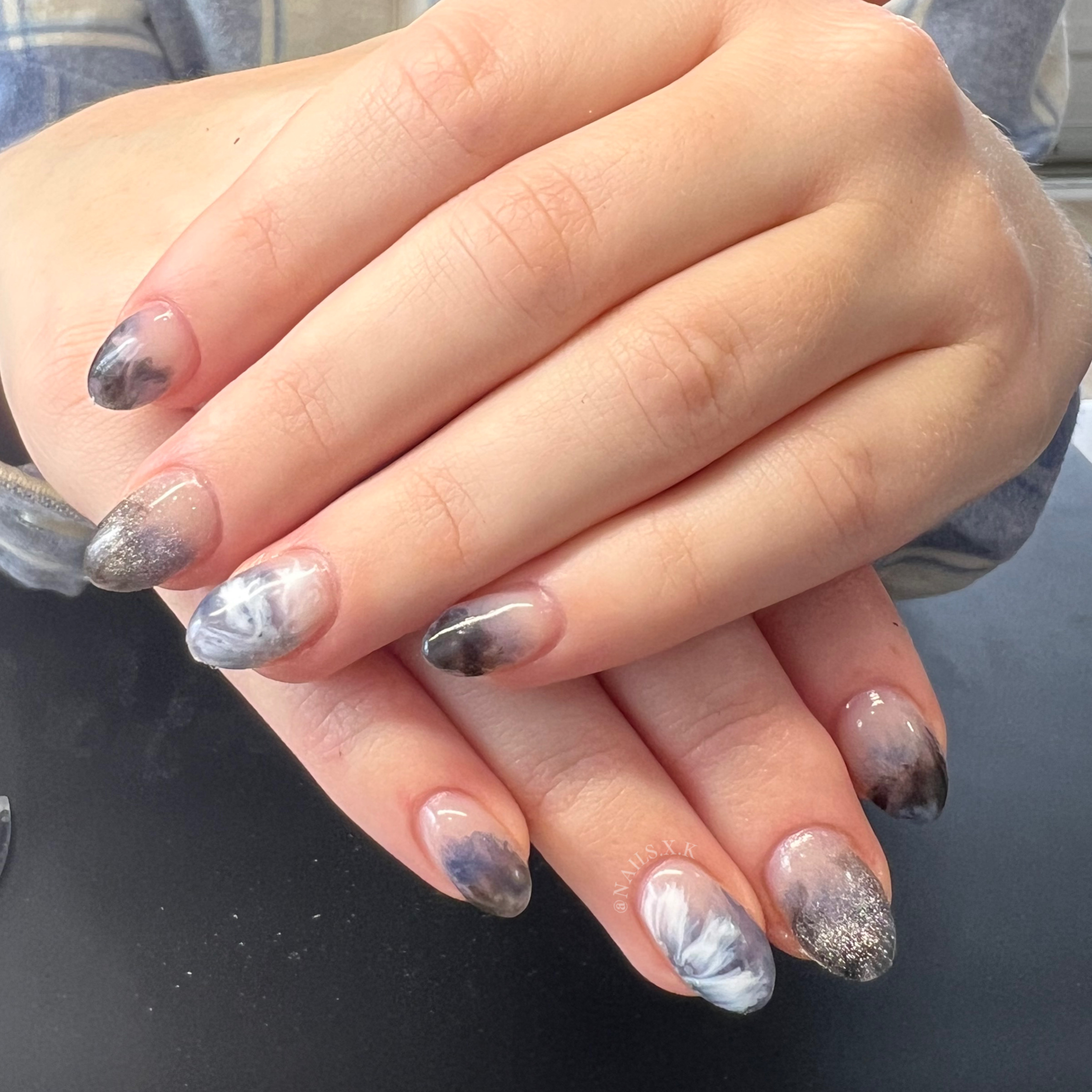 Hard gel nails with a marble and floral hand painted design. Nails by K
