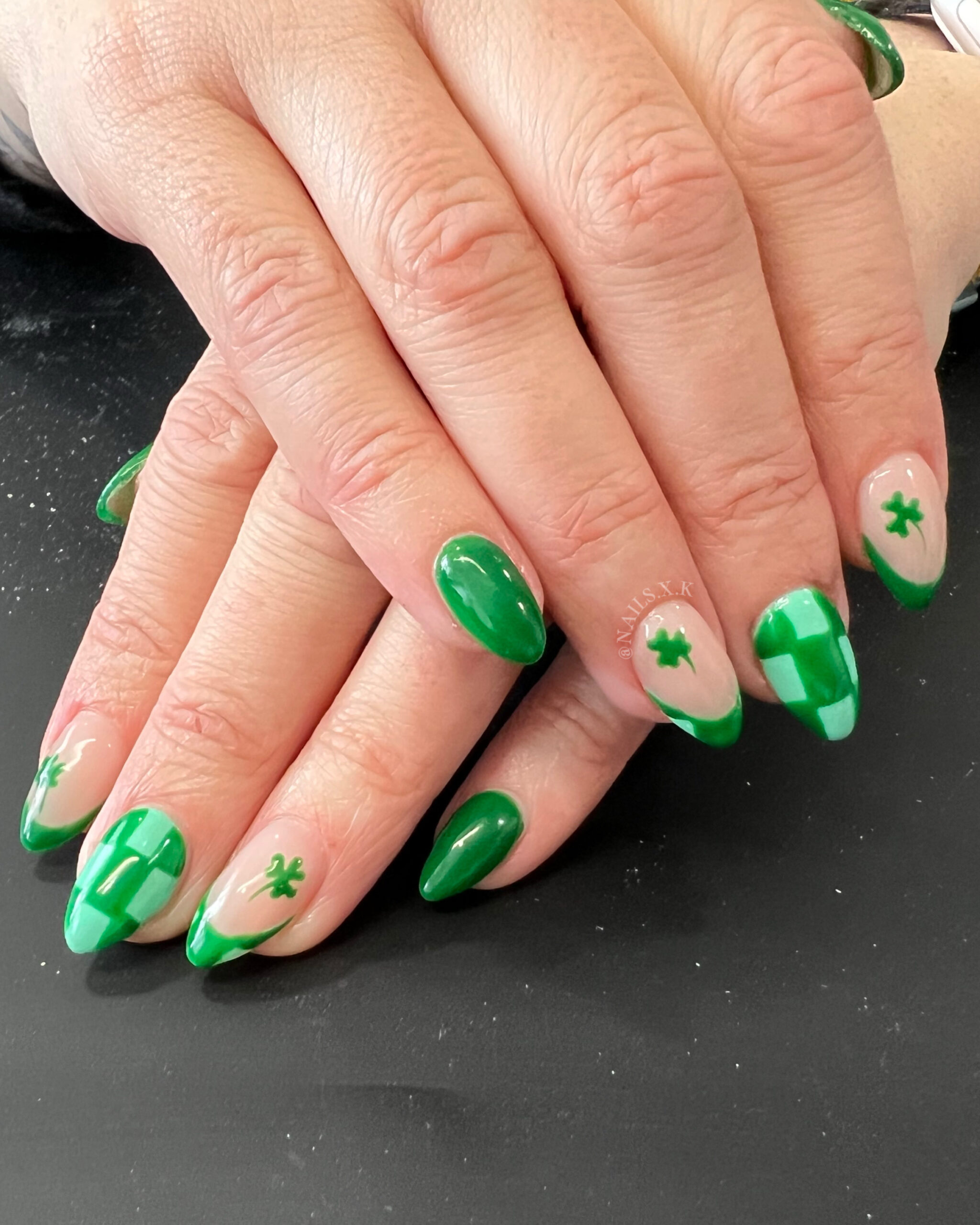Acrylic nails with a fun St. Patrick's Day design. Nails by K