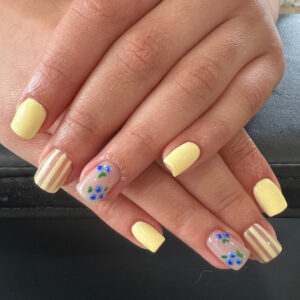 Nail art on acrylic nails of blueberries.