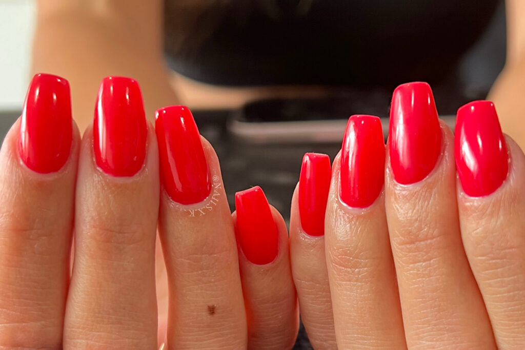 Hard gel nails with a red gel polish finish by Nails by K.