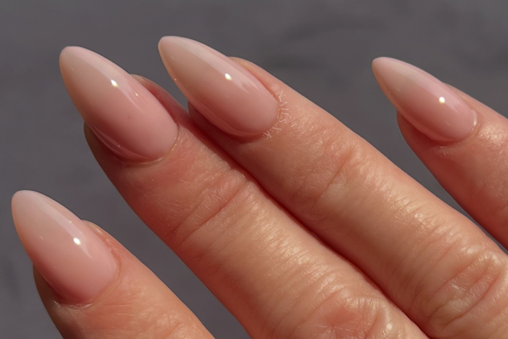 Close-up of nude acrylic nails by Nails by K.